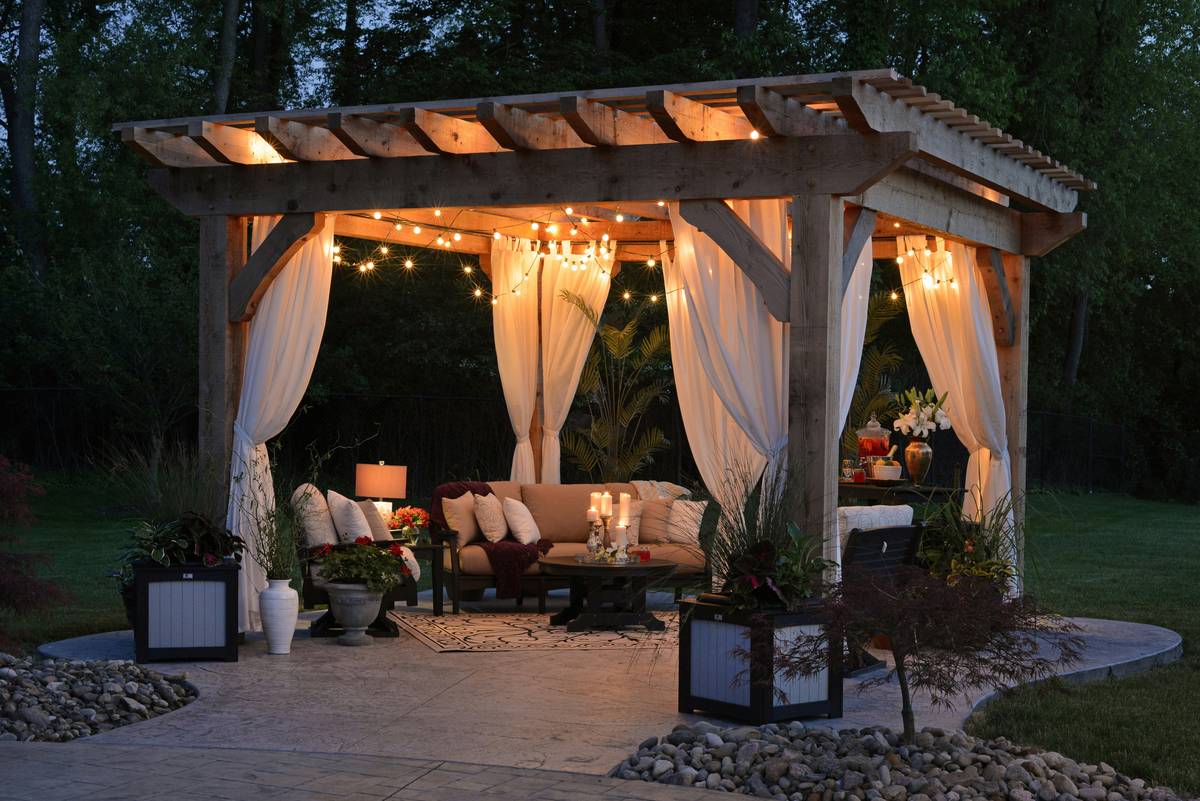 Silky ornamental feature curtain installed on a covered patio with integrated smart motor and remote control