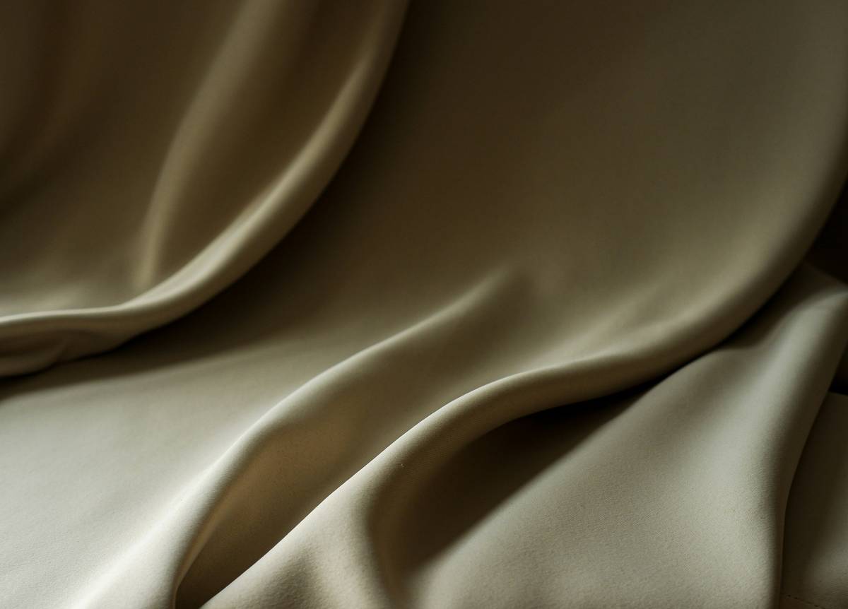 Close-up of silk ornamental feature curtain showing texture and how it interacts with natural sunlight