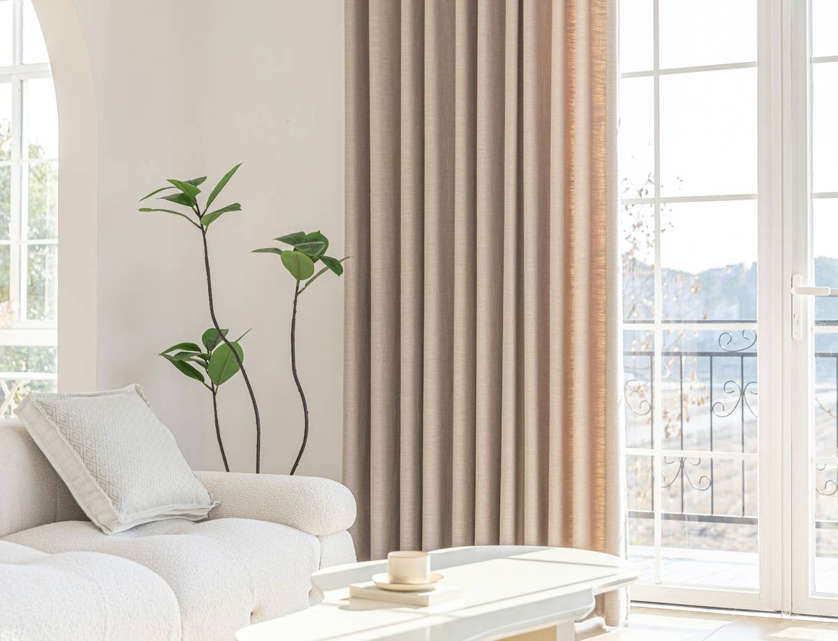 Smart curtains with outdoor scenes showing a forest landscape in a sunroom setting